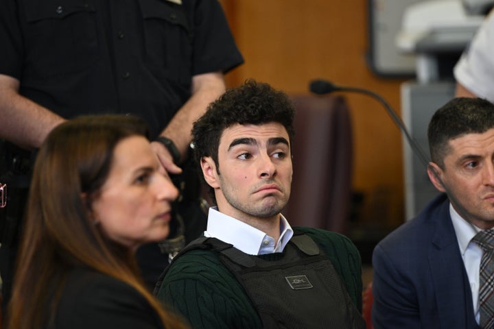 Mangione appears at a Feb. 21 hearing for the murder of health care executive Brian Thompson at Manhattan Criminal Court in New York City.